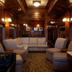 A lounging area with couches in a train car.