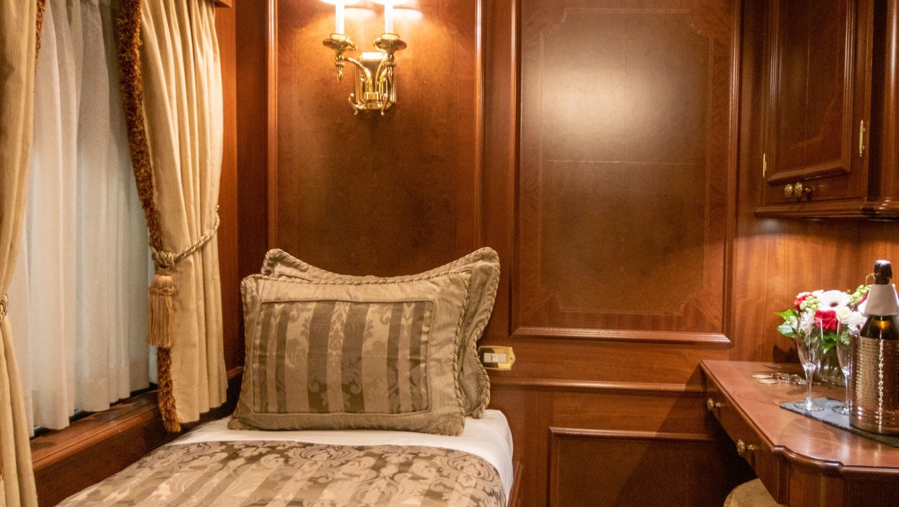 A bed in a train car.