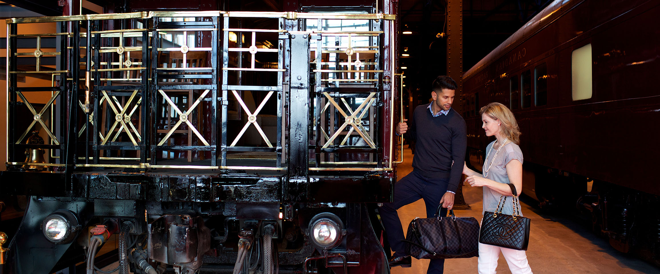 A couple about to board a railcar.