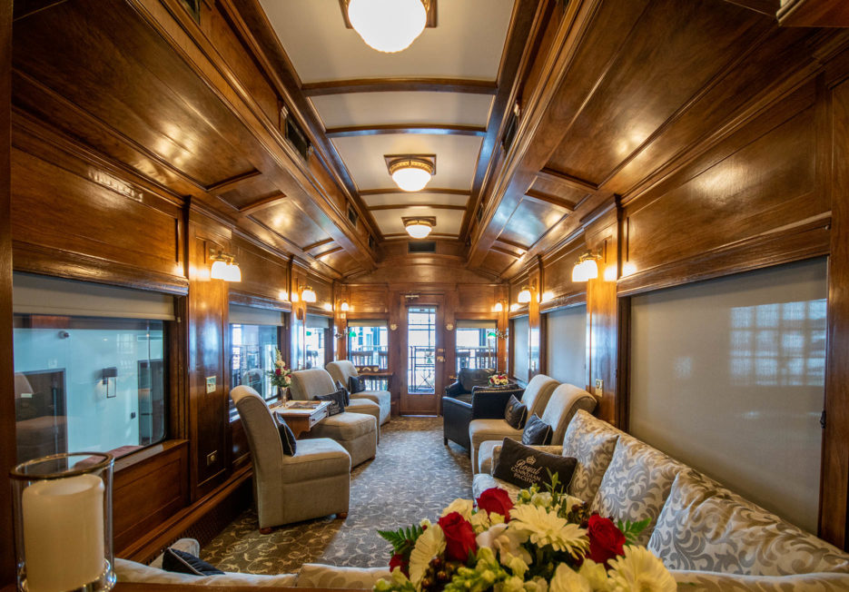 A seating area inside of a railcar.